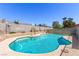 Backyard pool and patio area with well manicured landscaping at 6320 Peppermill Dr, Las Vegas, NV 89146