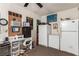 Utility Room includes a desk, refrigerator, shelving, and air conditioner at 6320 Peppermill Dr, Las Vegas, NV 89146