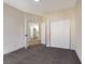 Bedroom with carpet, closet, and access to the kitchen, providing space and convenience at 6628 Silver Penny Ave, Las Vegas, NV 89108