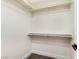 Walk-in closet with built-in shelving and carpeted floor at 6628 Silver Penny Ave, Las Vegas, NV 89108