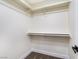 Well-organized closet space with built-in shelves and rods at 6628 Silver Penny Ave, Las Vegas, NV 89108