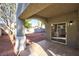 Covered patio with sliding glass door, providing a seamless transition to the backyard at 6628 Silver Penny Ave, Las Vegas, NV 89108