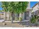 Charming two-story home with stucco siding, desert landscaping, and a covered front porch at 748 Canfield Point Ave, Las Vegas, NV 89183