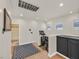 Hallway landing with an exercise bike, a bathroom, and additional storage space at 748 Canfield Point Ave, Las Vegas, NV 89183