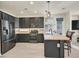 Modern kitchen boasts stainless steel appliances, sleek countertops, and ample cabinet space, ideal for cooking and entertaining at 748 Canfield Point Ave, Las Vegas, NV 89183