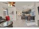 The airy open-plan living area connects to a modern kitchen, creating a warm and inviting atmosphere at 748 Canfield Point Ave, Las Vegas, NV 89183