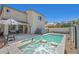 A stunning pool and spa combination highlight the backyard, complete with an umbrella-covered patio at 748 Canfield Point Ave, Las Vegas, NV 89183