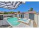 Backyard features a refreshing pool, a relaxing spa, and privacy fencing, perfect for outdoor enjoyment at 748 Canfield Point Ave, Las Vegas, NV 89183