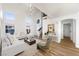 Bright living room featuring high ceilings, hardwood floors and modern decor at 7832 Desert Candle Way, Las Vegas, NV 89128