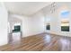 Spacious living room with vaulted ceilings, ample natural light, and new wood-look flooring at 7832 Desert Candle Way, Las Vegas, NV 89128