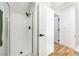 Tiled walk-in shower featuring glass doors and modern shower head at 7832 Desert Candle Way, Las Vegas, NV 89128