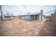 Expansive backyard with cinder block fencing, storage shed, and rear home elevation at 815 Center St, Henderson, NV 89015