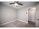 Bedroom featuring a ceiling fan, carpet, a closet, and a neutral color palette at 815 Center St, Henderson, NV 89015