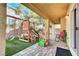 Covered patio and backyard with a play structure, perfect for outdoor entertainment and recreation at 8456 Blackstone Ridge Ct, Las Vegas, NV 89139
