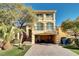 Charming two-story home with lush landscaping and a two-car garage providing a welcoming entrance at 8456 Blackstone Ridge Ct, Las Vegas, NV 89139