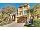 Inviting two-story home with a well-manicured lawn, two-car garage, and charming second story balcony at 8456 Blackstone Ridge Ct, Las Vegas, NV 89139