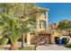 Two-story home with mature landscaping and a two-car garage, offering curb appeal and ample parking at 8456 Blackstone Ridge Ct, Las Vegas, NV 89139