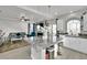 Open-concept kitchen with modern appliances, a central island with seating, and a bright, airy atmosphere at 8456 Blackstone Ridge Ct, Las Vegas, NV 89139