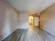 Bare bedroom offers wood-look flooring, neutral walls, and access to a bathroom at 9000 Las Vegas Blvd # 1097, Las Vegas, NV 89123