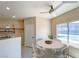 Cozy dining nook features a modern table, ceiling fan, and large window at 9000 Las Vegas Blvd # 1097, Las Vegas, NV 89123
