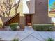 Building entrance featuring a brown door, gray walkway and green landscaping at 9000 Las Vegas Blvd # 1097, Las Vegas, NV 89123