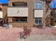 View of the building exterior with red rock landscaping, windows and balcony at 9000 Las Vegas Blvd # 1097, Las Vegas, NV 89123