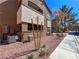 View of the building exterior with red rock landscaping, windows and balcony at 9000 Las Vegas Blvd # 1097, Las Vegas, NV 89123