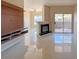 Bright living room with a fireplace, balcony access, and stylish built-in shelves at 9000 Las Vegas Blvd # 1097, Las Vegas, NV 89123