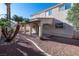 Exterior view of a covered patio and low-maintenance backyard at 9139 Scallop Reef Ave, Las Vegas, NV 89147