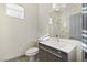 Bathroom featuring a sleek single sink vanity, modern fixtures, and a separate shower at 9139 Scallop Reef Ave, Las Vegas, NV 89147