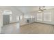Bright open-concept living room featuring tile floors and a vaulted ceiling at 9139 Scallop Reef Ave, Las Vegas, NV 89147
