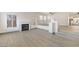Living room featuring a fireplace, large windows, and tile floors at 9139 Scallop Reef Ave, Las Vegas, NV 89147