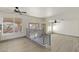Open concept living room with hard surface floors, a ceiling fan and railing overlooking the first floor at 9139 Scallop Reef Ave, Las Vegas, NV 89147