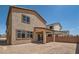 The backyard features a covered patio and block wall, providing a private outdoor space at 9825 Lost Horse Ave, Las Vegas, NV 89178