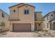 Charming two-story home with a brick driveway and a two-car garage in a well-maintained neighborhood at 9825 Lost Horse Ave, Las Vegas, NV 89178