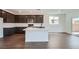 Stylish kitchen featuring a center island, sleek countertops, modern appliances, and ample cabinet space at 9825 Lost Horse Ave, Las Vegas, NV 89178
