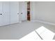 Bright bedroom features white carpet, closet, baseboards, and opens to main living area at 990 Golden Summit Dr, Las Vegas, NV 89138
