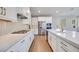 A spacious kitchen with stainless steel appliances, long countertops, and modern white cabinets at 990 Golden Summit Dr, Las Vegas, NV 89138