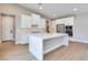 Bright, modern kitchen with white cabinets, stainless steel appliances, and a large island at 990 Golden Sands Dr, Las Vegas, NV 89128