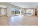 Open living area with a kitchen and sliding doors to the outside at 990 Golden Summit Dr, Las Vegas, NV 89138
