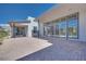Spacious brick patio with large glass doors and modern architecture for outdoor living at 990 Golden Summit Dr, Las Vegas, NV 89138