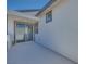 Cozy outdoor patio with sliding glass doors and stucco walls at 991 Golden Summit Ave, Las Vegas, NV 89138