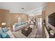 Staged living room boasts hardwood floors and an open floor plan at 9917 Arbuckle Dr, Las Vegas, NV 89134