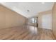 Empty living room with wood floors and natural light from the front windows at 9917 Arbuckle Dr, Las Vegas, NV 89134