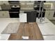 Kitchen sample featuring stainless steel appliances, Benton Flagstone cabinets, and Quartz Niagara countertop at 10004 River Corral St, Las Vegas, NV 89166