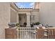 Cozy courtyard with outdoor seating, decorative accents, and a charming white gate at 10035 Oak Creek Canyon Ave, Las Vegas, NV 89147