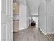 Inviting foyer with wood-look flooring, built-in cabinets, and views into the living space at 10035 Oak Creek Canyon Ave, Las Vegas, NV 89147
