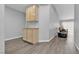 Bright living room featuring wood-style floors and natural-colored cabinets at 10035 Oak Creek Canyon Ave, Las Vegas, NV 89147