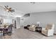 Spacious living area with wood-look floors, neutral paint, and comfortable seating at 10035 Oak Creek Canyon Ave, Las Vegas, NV 89147