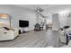 Open-concept living space with a ceiling fan, recessed lighting, and view of the kitchen at 10035 Oak Creek Canyon Ave, Las Vegas, NV 89147
